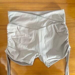 Women’s pchee bum tan cross over waist scrunch butt shorts in size medium